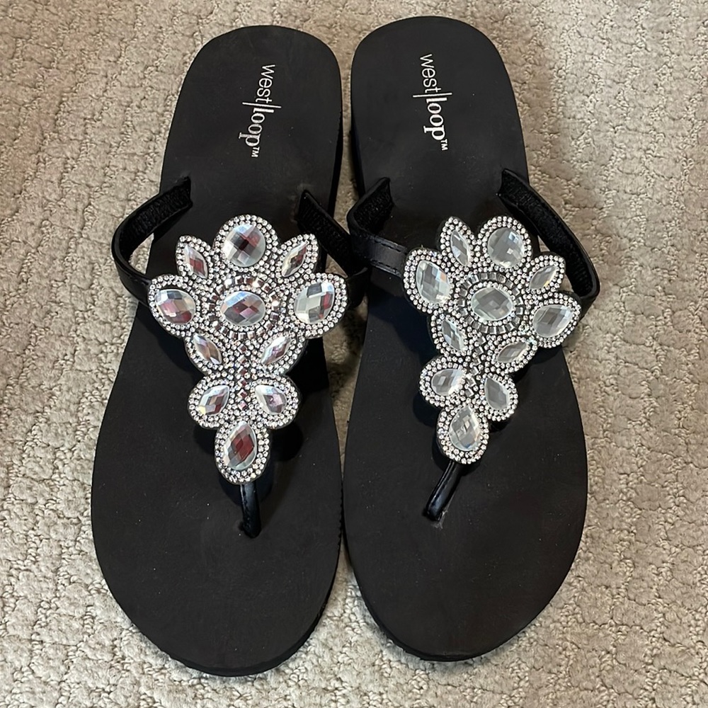 Worn once. Black bing flip flops.